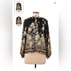 Long sleeved floral top with optional tie closures.